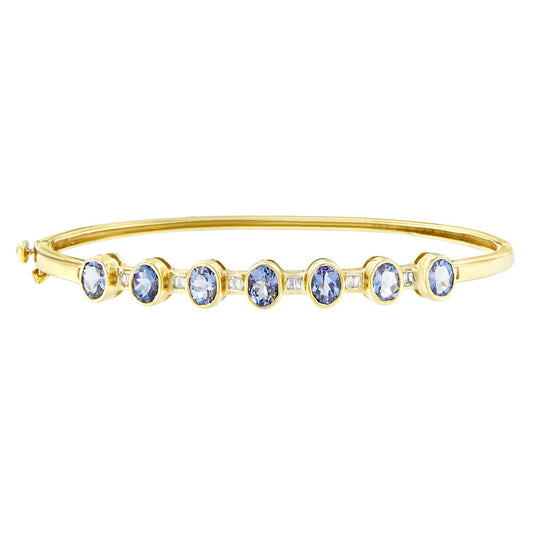 14K Yellow Gold Alternating Bezel Set 5MM Oval Shaped Tanzanite and 1/5 Cttw Diamond Bangle Bracelet (H-I Color, VS2-SI1 Clarity) - Fit's wrists up to 7.25" Inches
